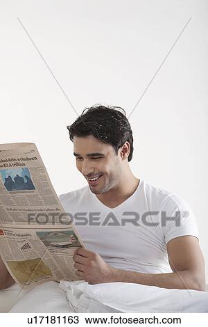Man reading a newspaper View Large Photo Image Stock Image - Man reading a newspaper. Fotosearch