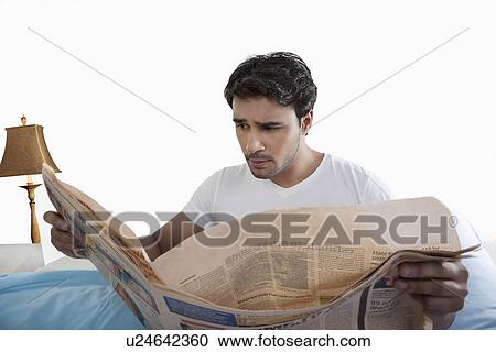 Man reading a newspaper View Large Photo Image Stock Image - Man reading a newspaper. Fotosearch