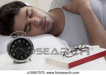 Man sleeping in bed View Large Photo Image Stock Image - Man sleeping in bed. Fotosearch