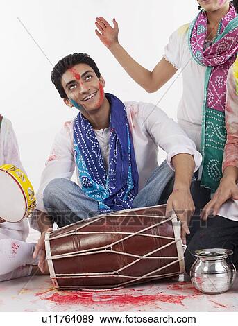 Man with a dholak View Large Photo Image Stock Photo - Man with a dholak. Fotosearch