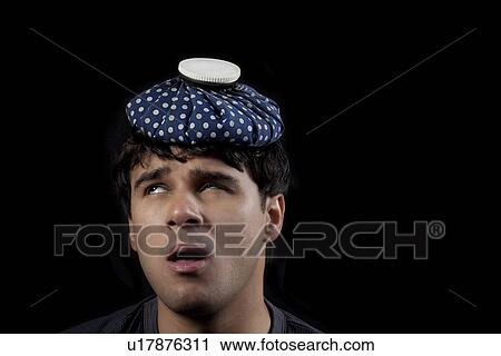 Man with a hot water bag on his head View Large Photo Image Stock Image - Man with a hot water bag on his head. Fotosearch