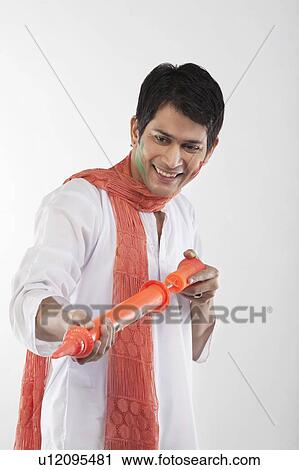 Man with a pichkari View Large Photo Image Stock Image - Man with a pichkari. Fotosearch