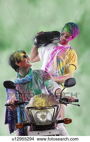 Picture - Men enjoying themselves on holi. Fotosearch