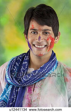 Portrait of a man with colour on his face View Large Photo Image Picture - Portrait of a man with colour on his face. Fotosearch