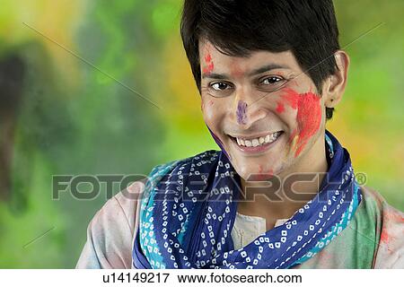 Stock Photo - Portrait of a man with colour on his face. Fotosearch