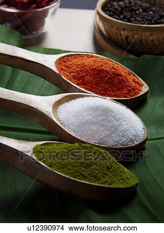 Spices in wooden spoons View Large Photo Image Picture - Spices in wooden spoons. Fotosearch
