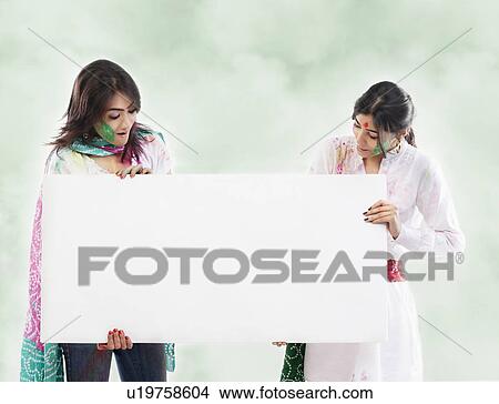 Picture - Two women holding a placard. Fotosearch