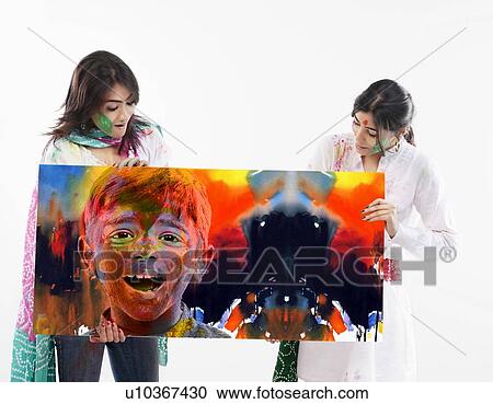 Stock Image - Two women holding a placard. Fotosearch