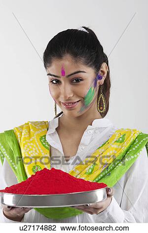 Stock Image - Woman holding a tray of colours. Fotosearch