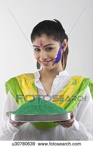 Stock Photo - Woman holding a tray of colours. Fotosearch