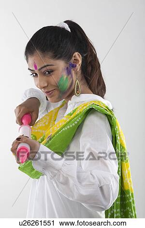 Woman with a pichkari View Large Photo Image Stock Image - Woman with a pichkari. Fotosearch