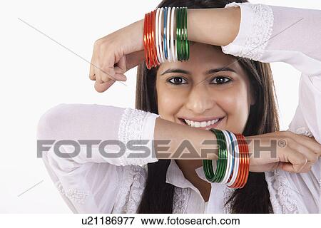 Woman with bangles View Large Photo Image Stock Photo - Woman with bangles. Fotosearch