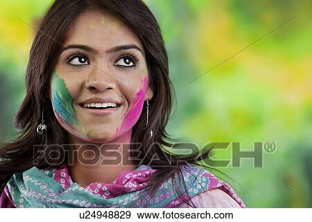 Woman with colour on her face View Large Photo Image Stock Photo - Woman with colour on her face. Fotosearch