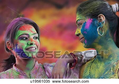 Stock Photography - Women covered in holi colours. Fotosearch