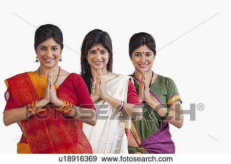 Stock Photo - Women greeting. Fotosearch