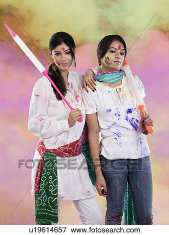 Stock Photo - Women posing with pichkaris. Fotosearch