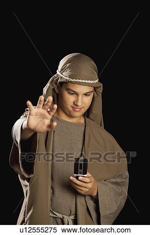 boy depicting jesus holding a cellphone View Large Photo Image Stock Photography - boy depicting jesus holding a cellphone. Fotosearch