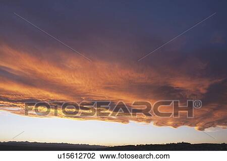 Stock Image - chinook arch at sunset, calgary, alberta, canada. Fotosearch