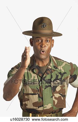 Stock Image - fort lauderdale, florida, united states of america; a military man giving orders. Fotosearch