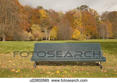 Stock Photography - kelso, scottish borders, scotland; bench in the park in autumn. Fotosearch