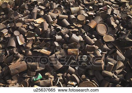 Stock Photography - pile of rusted cans, siwa, egypt. Fotosearch