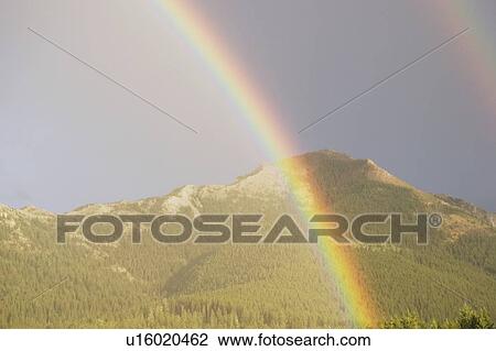 Rainbow over mountains, Jasper National Park, Alberta, Canada View Large Photo Image Stock Image - Rainbow over mountains, Jasper National Park, Alberta, Canada. Fotosearch