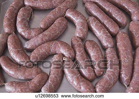 uncooked sausage on a baking sheet View Large Photo Image Stock Image - uncooked sausage on a baking sheet. Fotosearch