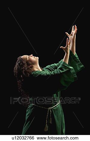 Stock Photograph - woman worshiping. Fotosearch