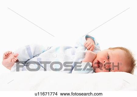 Picture - Baby Laying On Towel. Fotosearch