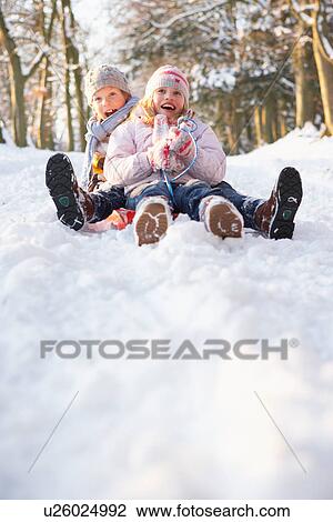 Boy And Girl Sledging Through Snowy Woodland View Large Photo Image Stock Image - Boy And Girl Sledging Through Snowy Woodland. Fotosearch