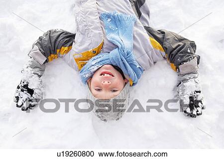 Boy Laying On Ground Making Snow Angel View Large Photo Image Stock Image - Boy Laying On Ground Making Snow Angel. Fotosearch