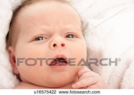 Stock Image - Close Up Of Baby On Towel. Fotosearch