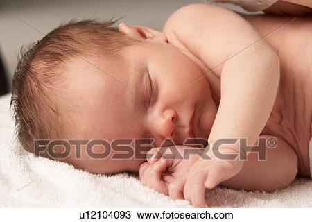 Close Up Of Baby Sleeping On Towel View Large Photo Image Stock Image - Close Up Of Baby Sleeping On Towel. Fotosearch