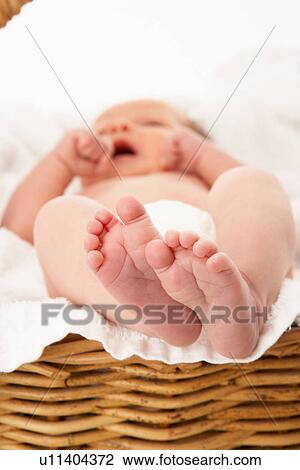 Stock Image - Close Up Of Baby's Feet On Towel. Fotosearch