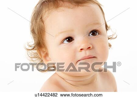 Stock Image - Close Up Studio Portrait Of Baby Boy. Fotosearch