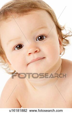 Stock Image - Close Up Studio Portrait Of Baby Boy. Fotosearch