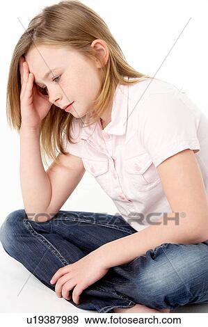 Stock Photo - Close Up Studio Portrait Of Sad Young Girl. Fotosearch