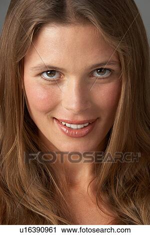 Close Up Studio Portrait Of Smiling Young Woman View Large Photo Image Stock Image - Close Up Studio Portrait Of Smiling Young Woman. Fotosearch