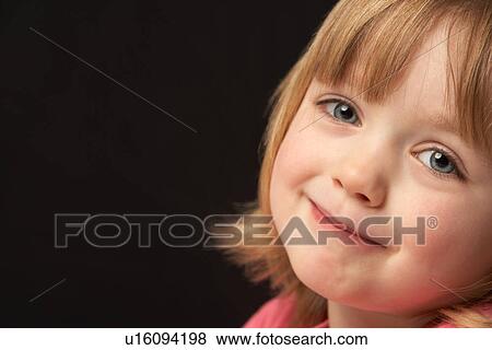 Close Up Studio Portrait Of Smiling Young Girl View Large Photo Image Stock Photo - Close Up Studio Portrait Of Smiling Young Girl. Fotosearch