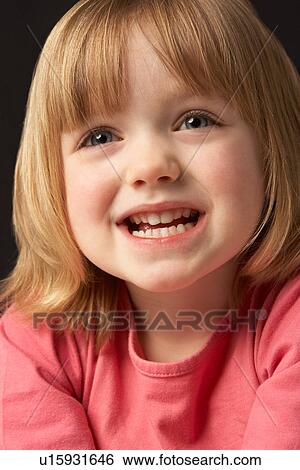 Close Up Studio Portrait Of Smiling Young Girl View Large Photo Image Stock Photograph - Close Up Studio Portrait Of Smiling Young Girl. Fotosearch