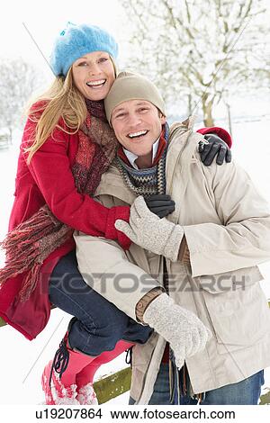 Couple Standing Outside In Snowy Landscape View Large Photo Image Picture - Couple Standing Outside In Snowy Landscape. Fotosearch