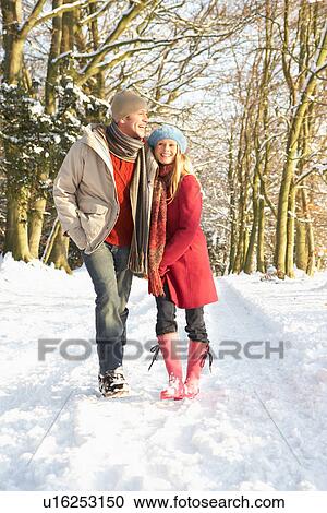 Couple Walking Through Snowy Woodland View Large Photo Image Stock Image - Couple Walking Through Snowy Woodland. Fotosearch