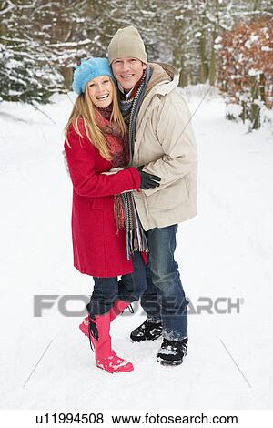 Couple Walking Through Snowy Woodland View Large Photo Image Stock Photo - Couple Walking Through Snowy Woodland. Fotosearch