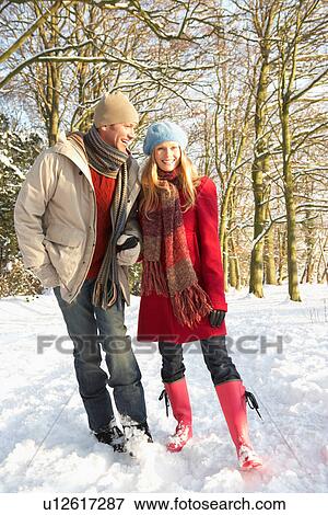 Couple Walking Through Snowy Woodland View Large Photo Image Stock Photo - Couple Walking Through Snowy Woodland. Fotosearch