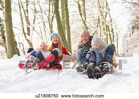 Family Sledging Through Snowy Woodland View Large Photo Image Stock Image - Family Sledging Through Snowy Woodland. Fotosearch
