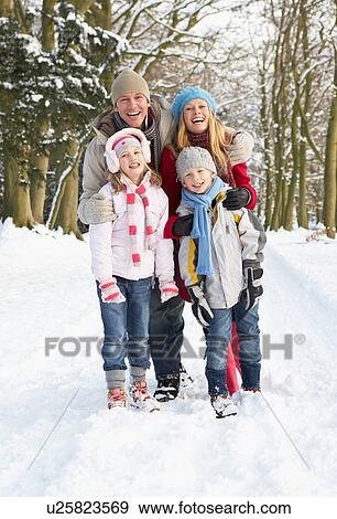 Family Walking Through Snowy Woodland View Large Photo Image Stock Photo - Family Walking Through Snowy Woodland. Fotosearch