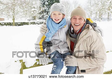 Father And Son Standing Outside In Snowy Landscape View Large Photo Image Stock Image - Father And Son Standing Outside In Snowy Landscape. Fotosearch
