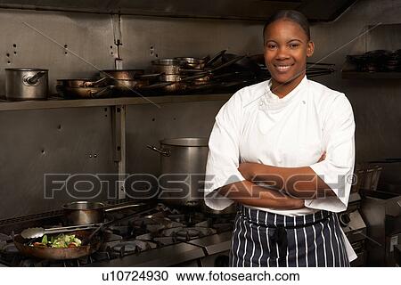 Female Chef Standing Next To Cooker In Restaurant Kitchen View Large Photo Image Stock Image - Female Chef Standing Next To Cooker In Restaurant Kitchen. Fotosearch