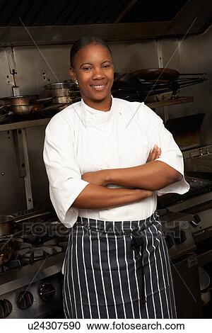 Female Chef Standing Next To Cooker In Restaurant Kitchen View Large Photo Image Stock Image - Female Chef Standing Next To Cooker In Restaurant Kitchen. Fotosearch