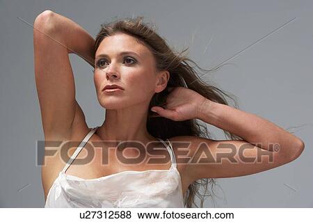 Full Length Studio Shot Of Young Woman In White Evening Dress View Large Photo Image Stock Photo - Full Length Studio Shot Of Young Woman In White Evening Dress. Fotosearch